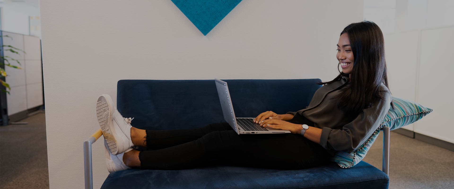 Lady sitting on sofa enjoying omni-channel customer experience